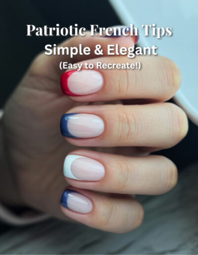 Nails with sheer nude base and fine red, white, and navy blue French tips on almond-shaped nails