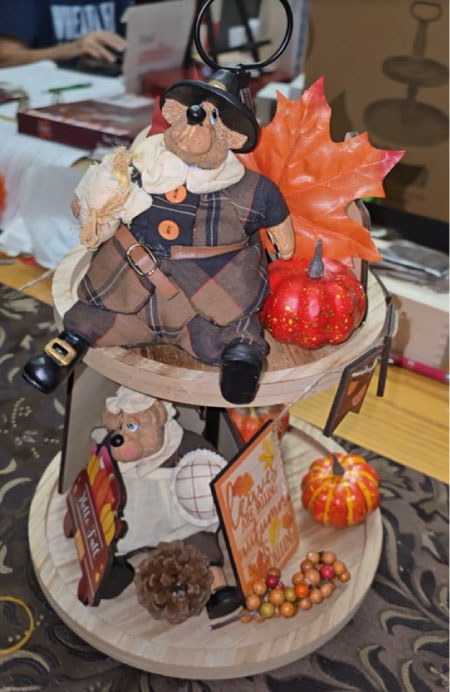 15-piece fall tiered tray decoration set arranged on a rustic two-tier tray, including pumpkins, gnome, wooden word signs, ladder, and autumn leaves. Tray not included, only decorative pieces.