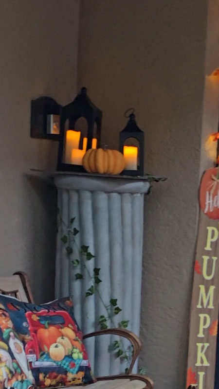 Black lanterns filled with glowing LED candles arranged along the steps.