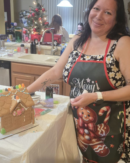 Eight Christmas aprons in various gingerbread-themed designs arranged together, showing red, green, and white holiday patterns. Overlay text reads ‘Festive Holiday Aprons.