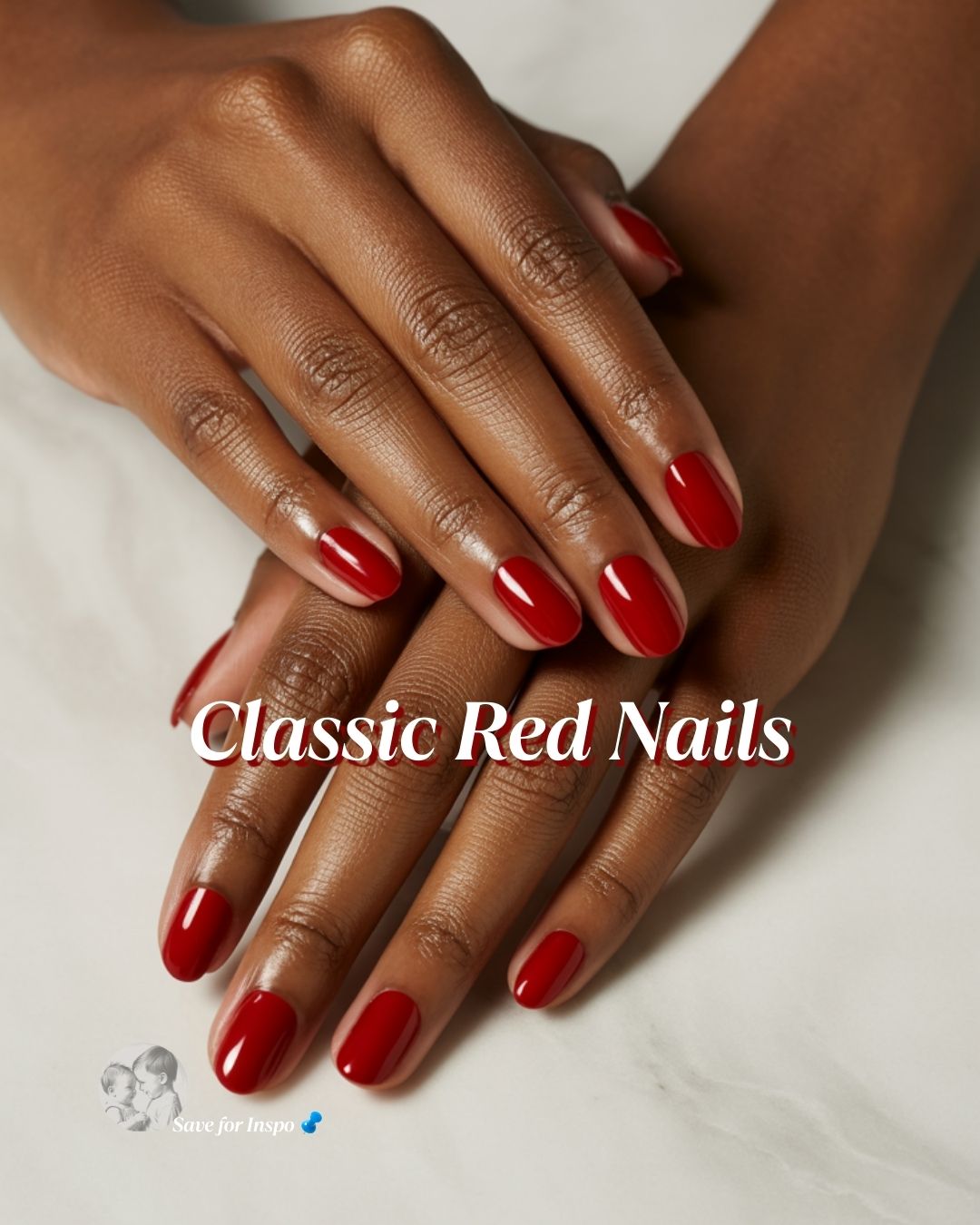Close-up of hands with a glossy classic red manicure resting on a neutral surface, showcasing timeless Valentine’s Day nails with a smooth, polished finish.