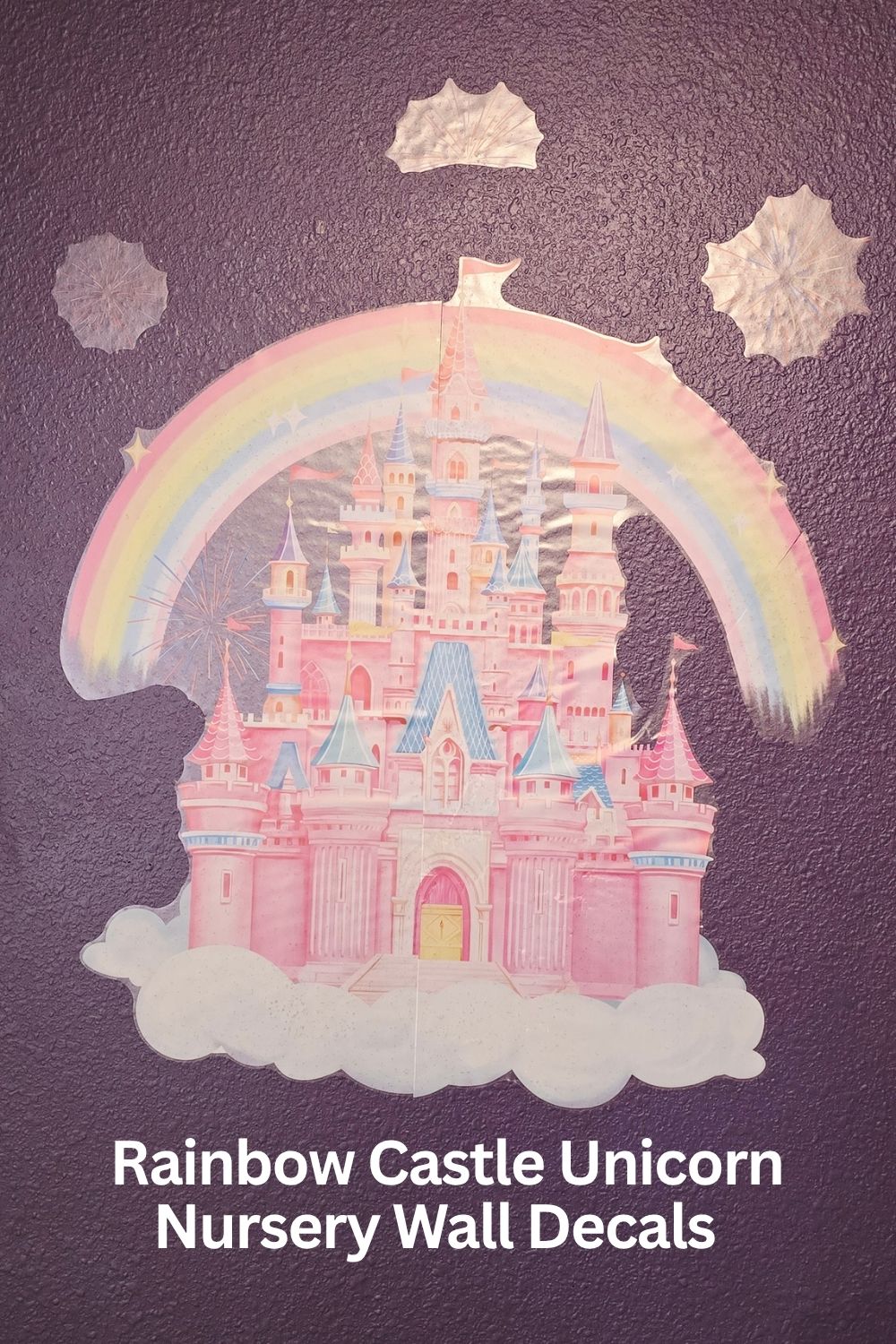 Pink castle wall decal with rainbow and unicorns on girls bedroom wall in girls room makeover
