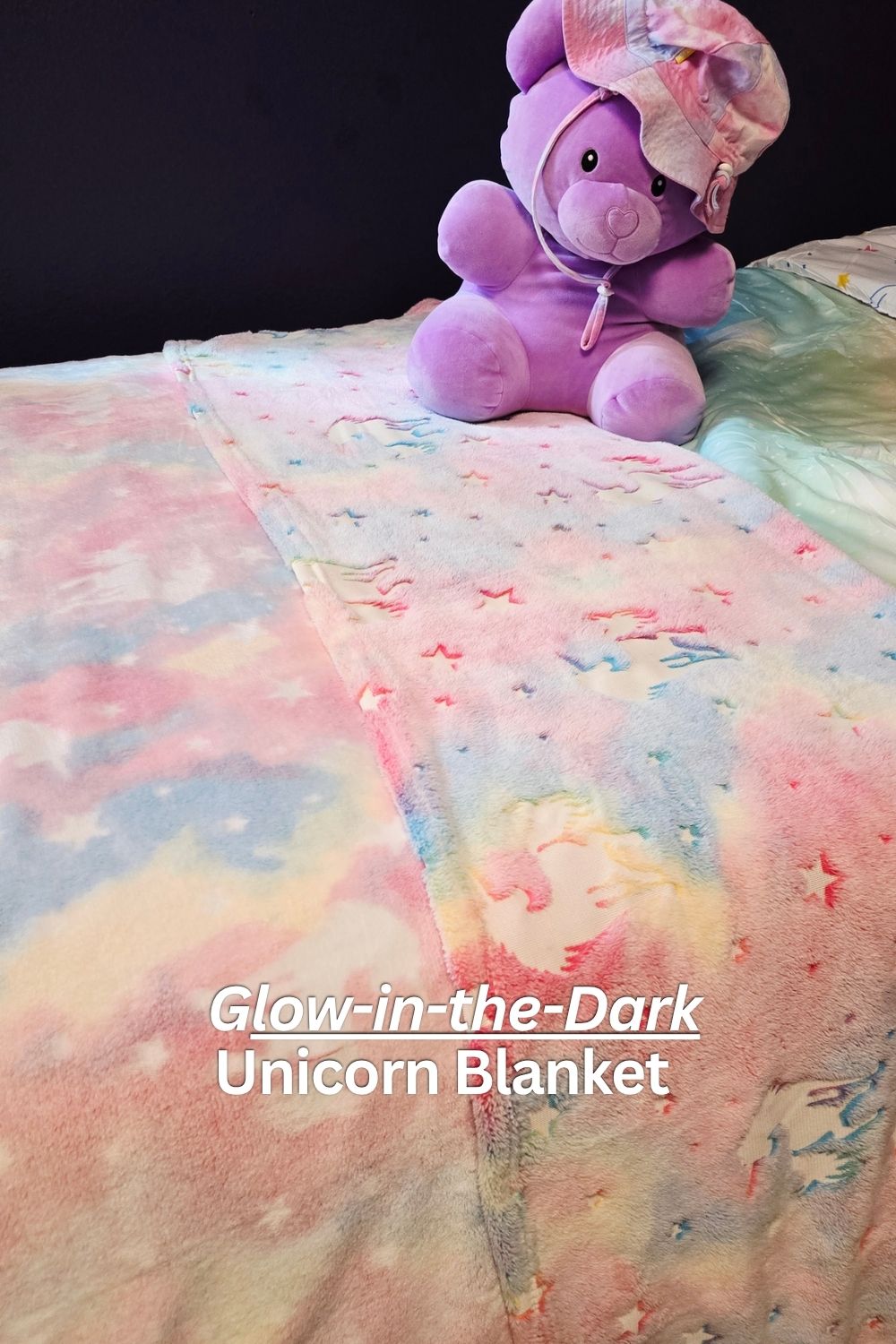 Glow in the dark unicorn blanket for girls room makeover with soft pink plush fabric and star patterns